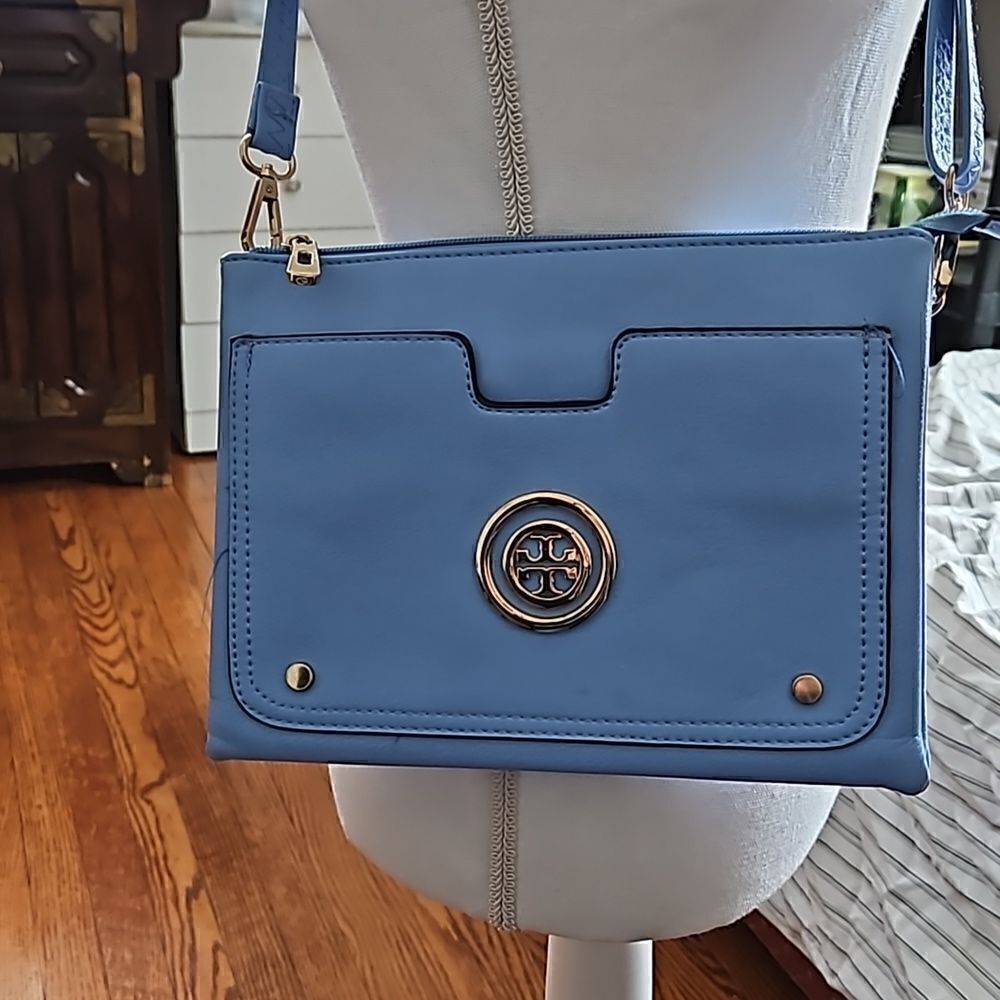 NEW Vegan friendly light blue handbag with adjustable and detachable strap.